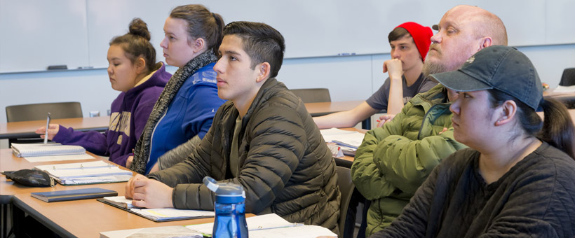 Students listening in class to a lecture