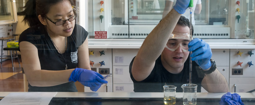 Students in chemistry lab with beakers
